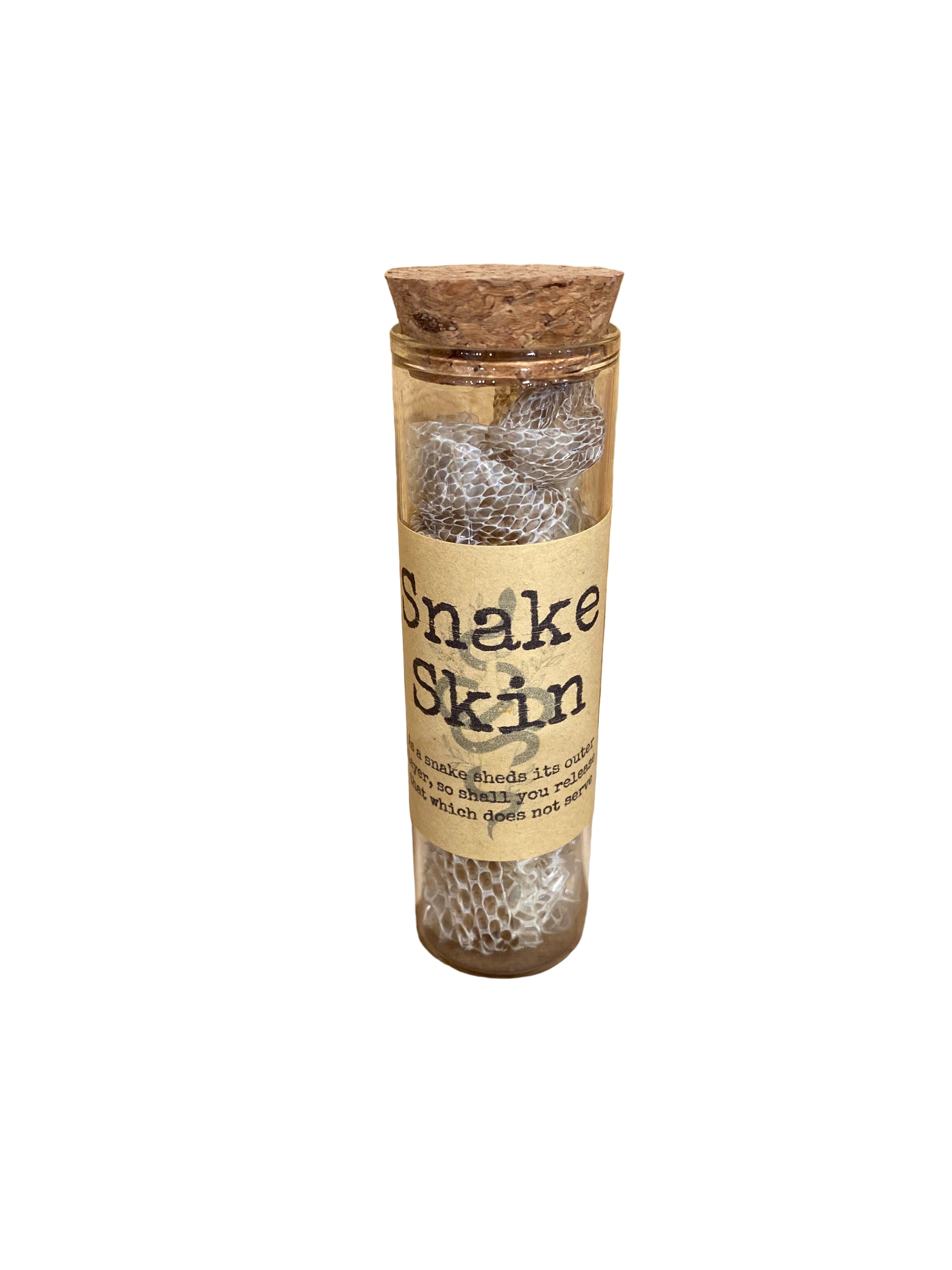 A bottle with a cork stopper, labeled 'Snake Skin', containing snake shed, presented on a wooden surface.