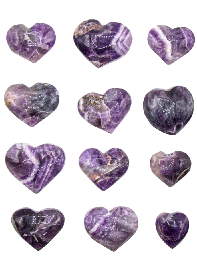 Purple heart-shaped stones on a white background