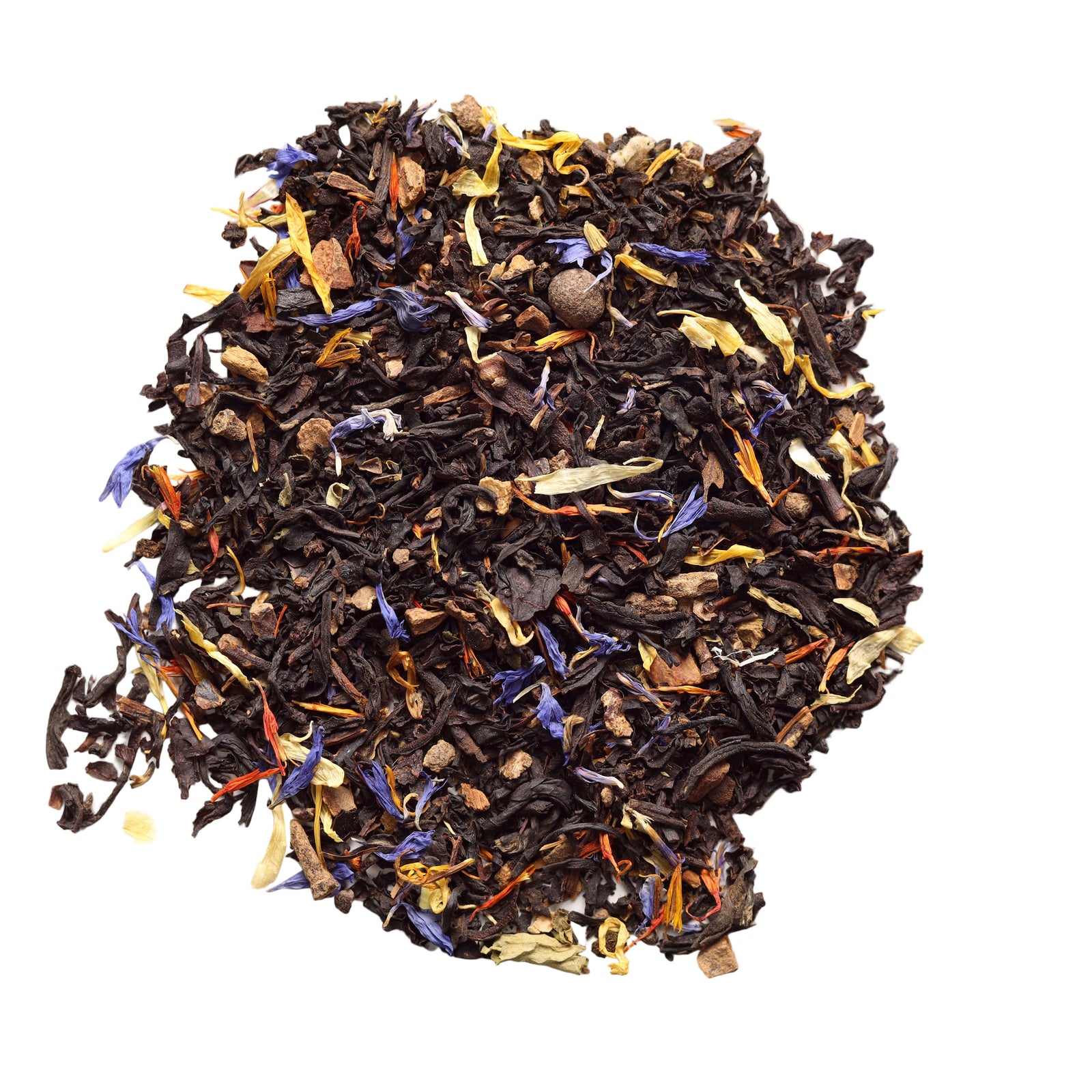 Assorted dried tea leaves on a light background