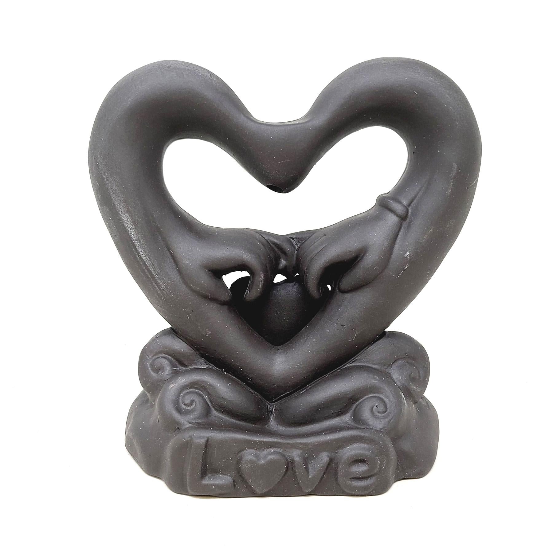 Hand Holding in Heart Backflow Incense Burner
