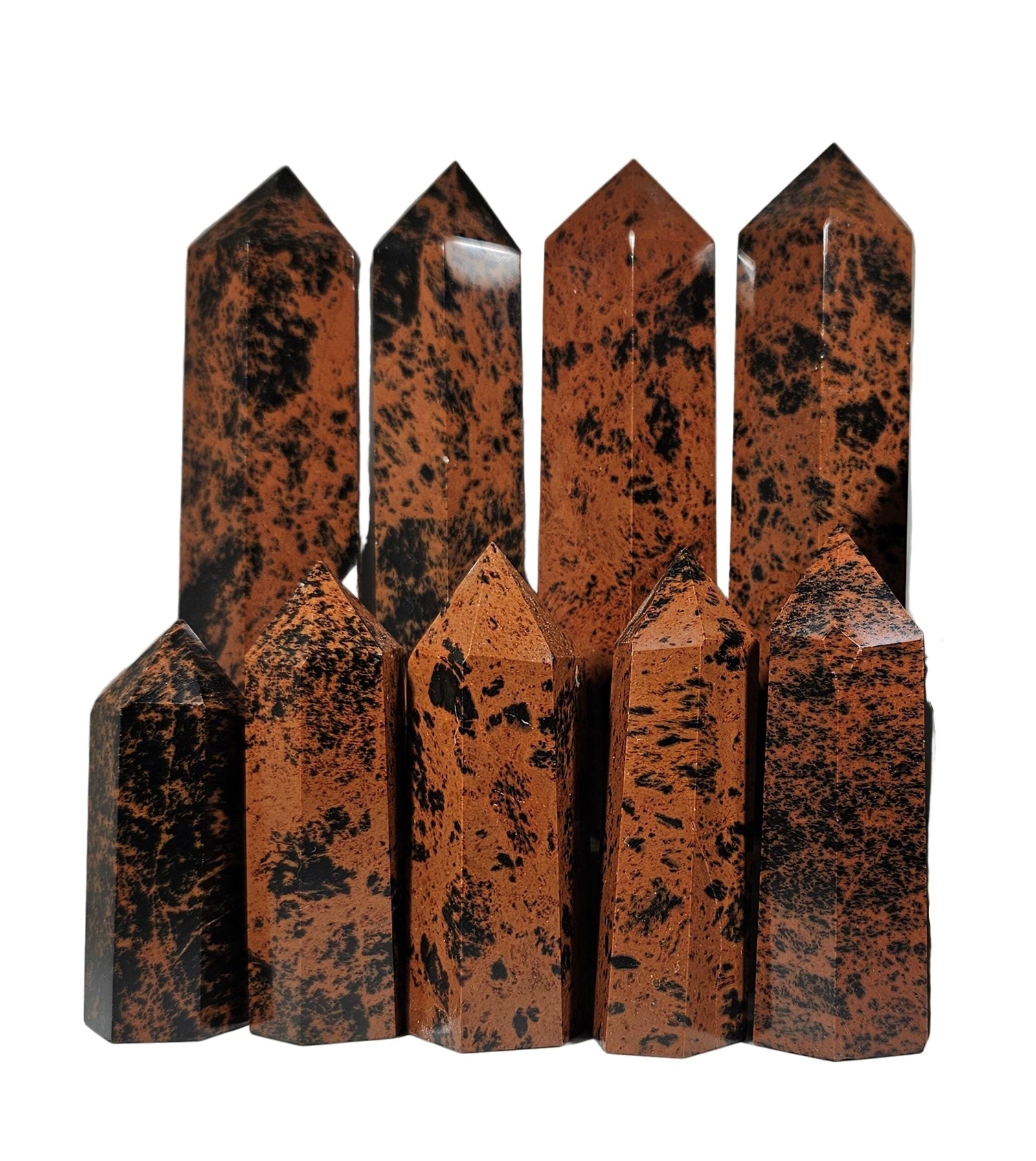 Set of five brown crystal points on a white background
